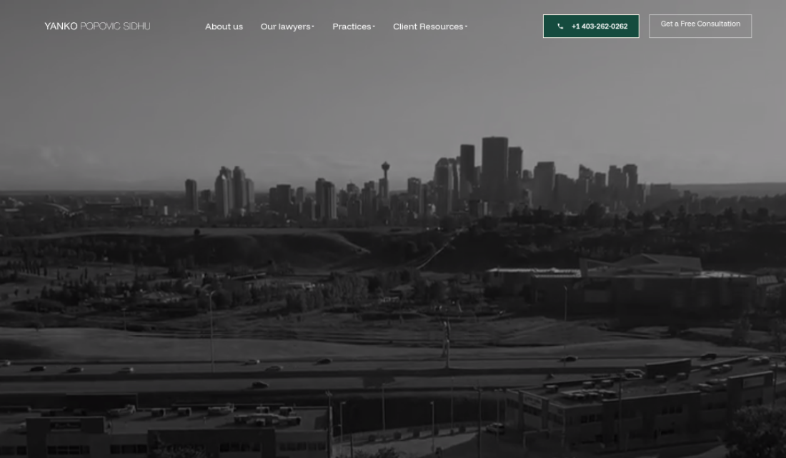 Captured homepage hero screenshot of Yanko showing its Calgary skyline hero and navigation