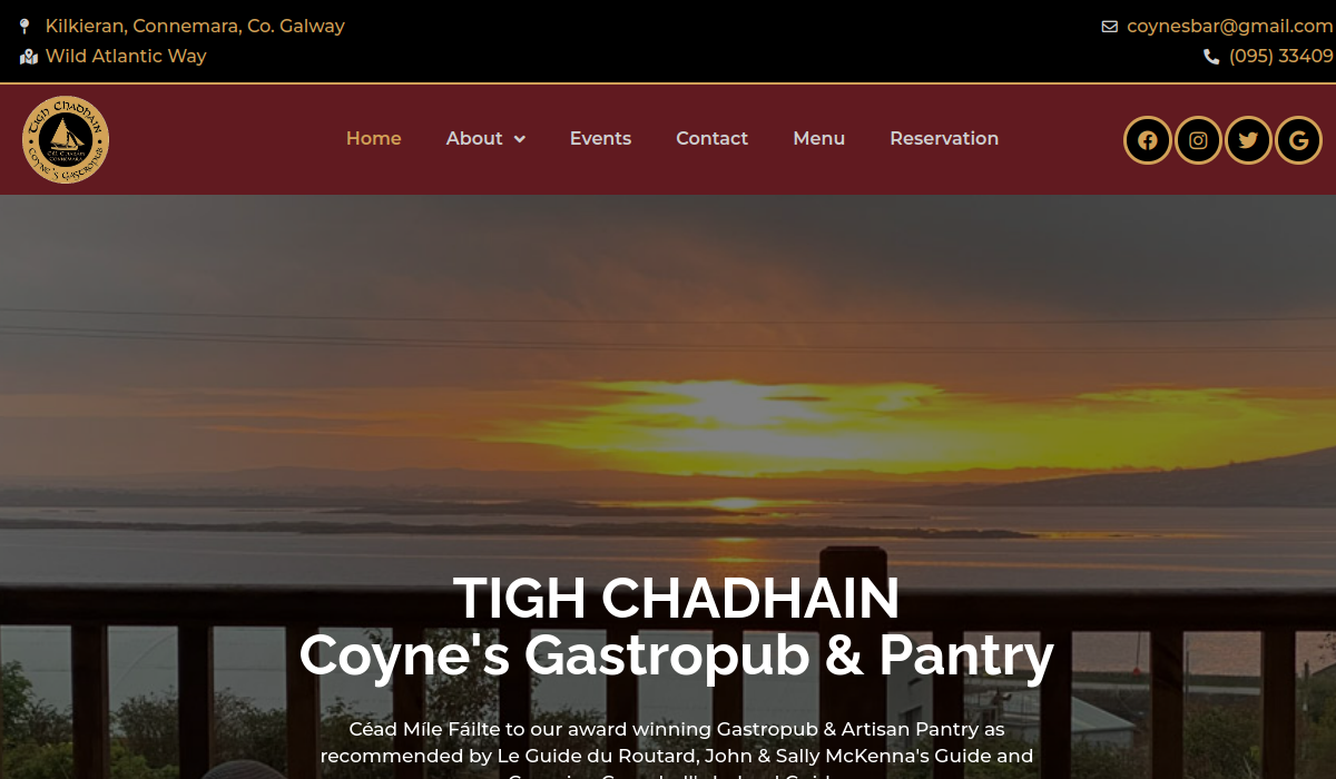 Coyne’s Gastropub homepage showing a coastal sunset